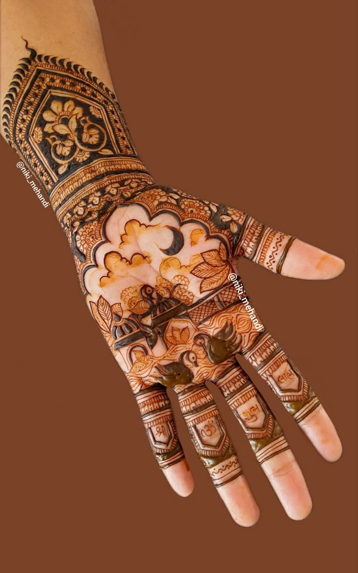 the hand is decorated with henna and flowers