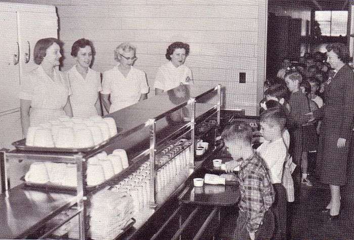 an old black and white photo of people in a hospital