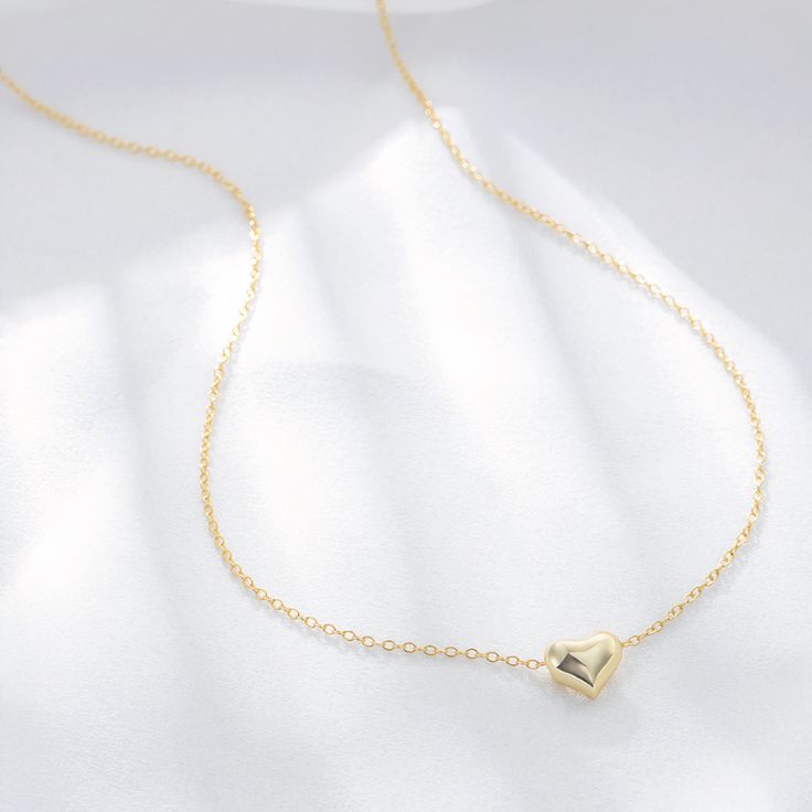 A gleaming heart of 18-karat gold anchors this chain necklace that makes a meaningful gift for a loved one. Hand-crafted using 18K gold plated sterling silver. - Care Instructions: Avoid contact with water, lotion, and perfume. Clean gently with a polishing cloth. Product Specifications: - 18K gold plating over .925 Sterling Silver - Hypoallergenic - Cubic Zirconia crystals Perfume Clean, Lotion And Perfume, Tuesday Morning, Gold Heart Necklace, Sweet Heart, Trendy Jewelry, Fine Jewellery Earrings, Chic Boutique, Gold Plated Sterling Silver