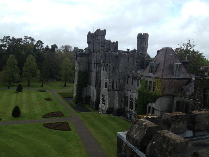 an aerial view of a castle with lots of green grass