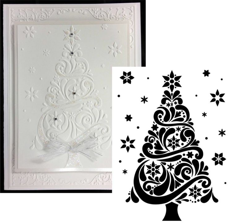 a white christmas tree with snowflakes and stars on it, next to a card