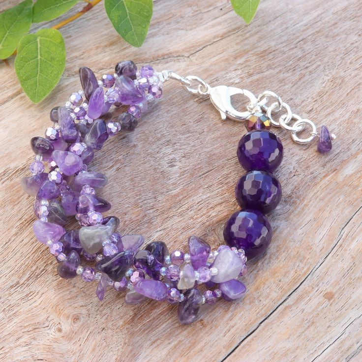 Does your spirit shine with a wise, spiritual and mystic aura? Then Nareerat's newest design is made for you and your vibrant essence! Working with sterling silver-plated accessories, the Thai artisan crafts this bold strand beaded bracelet, whose exquisite look is composed of natural amethyst, chalcedony, quartz and glass beads in charming purple hues, arranged on a silk thread that displays the gem's wise energy. Mystic Aura Quartz Bracelet, Purple Polished Bead Bracelet Jewelry, Purple Amethyst Beaded Bracelets With Polished Beads, Purple Polished Bead Bracelet, Purple Bracelet With Polished Beads, Adjustable Purple Gemstone Beads Crystal Bracelet, Adjustable Purple Crystal Bracelet Hand-strung, Purple Polished Beads Bracelet For Jewelry Making, Adjustable Purple Crystal Bracelet With Gemstone Beads