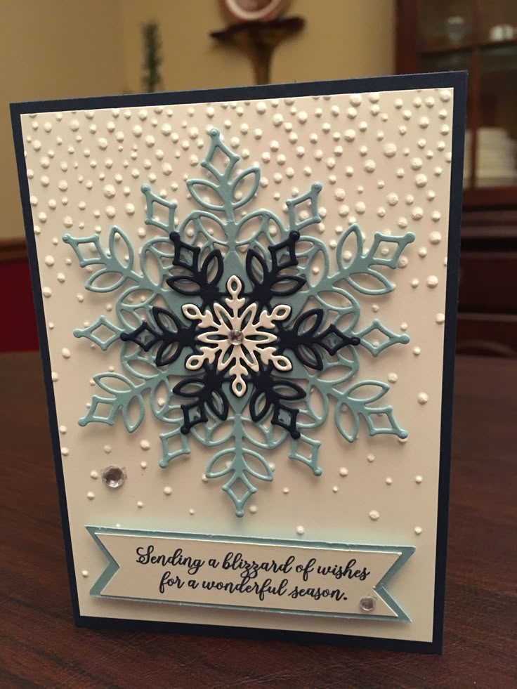 a card with a snowflake design on it