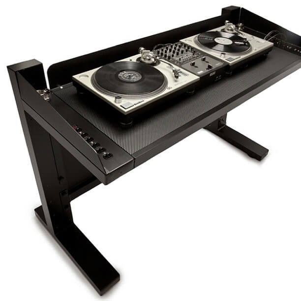 a dj turntable with two decks on top of it and an ipod dock attached to the table