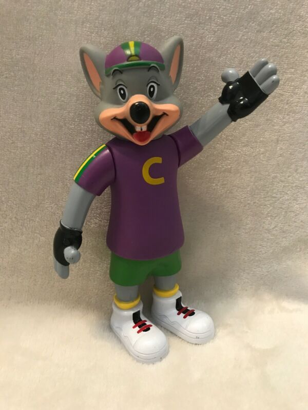 a figurine of a mouse wearing a purple shirt and green pants