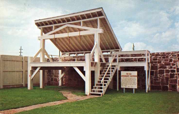 the structure is made out of wood and has stairs leading up to it