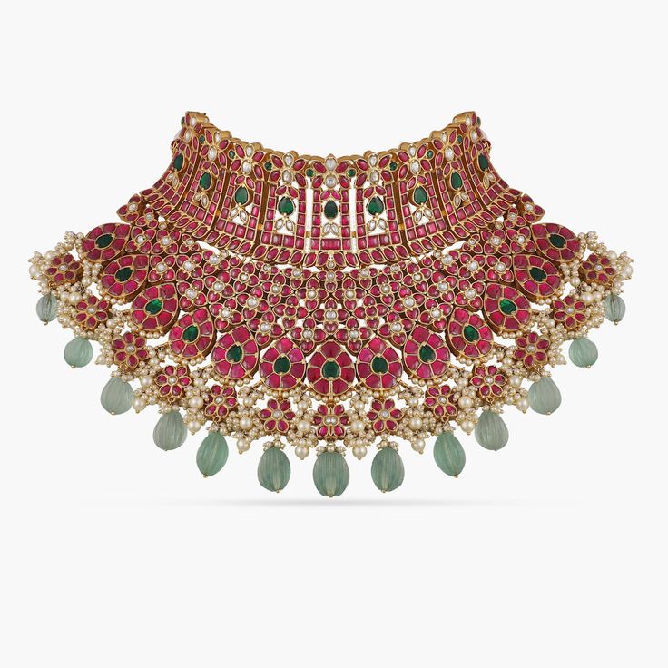 Padhma Classic Grandeur Silver Choker Festive Ruby Gemstone Jewelry, Fusion Style Kundan Necklace With Gemstones For Ceremonies, Ruby Fusion Jewelry With Intricate Design, Ruby Chandbali Necklace With Intricate Design, Fusion Chandbali Ruby Jewelry, Fusion Ruby Chandbali Jewelry, Temple Jewelry Ruby Pendant, Fusion Style Ruby Jewelry For Celebration, Ceremonial Temple Jewelry With Ruby