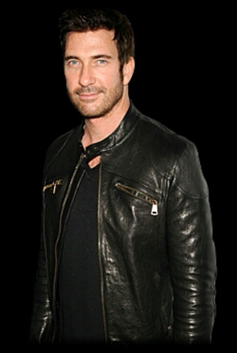 a man in a black shirt and leather jacket