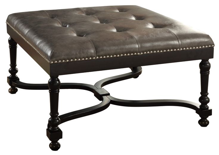 a brown leather ottoman sitting on top of a metal frame footstool in front of a white background