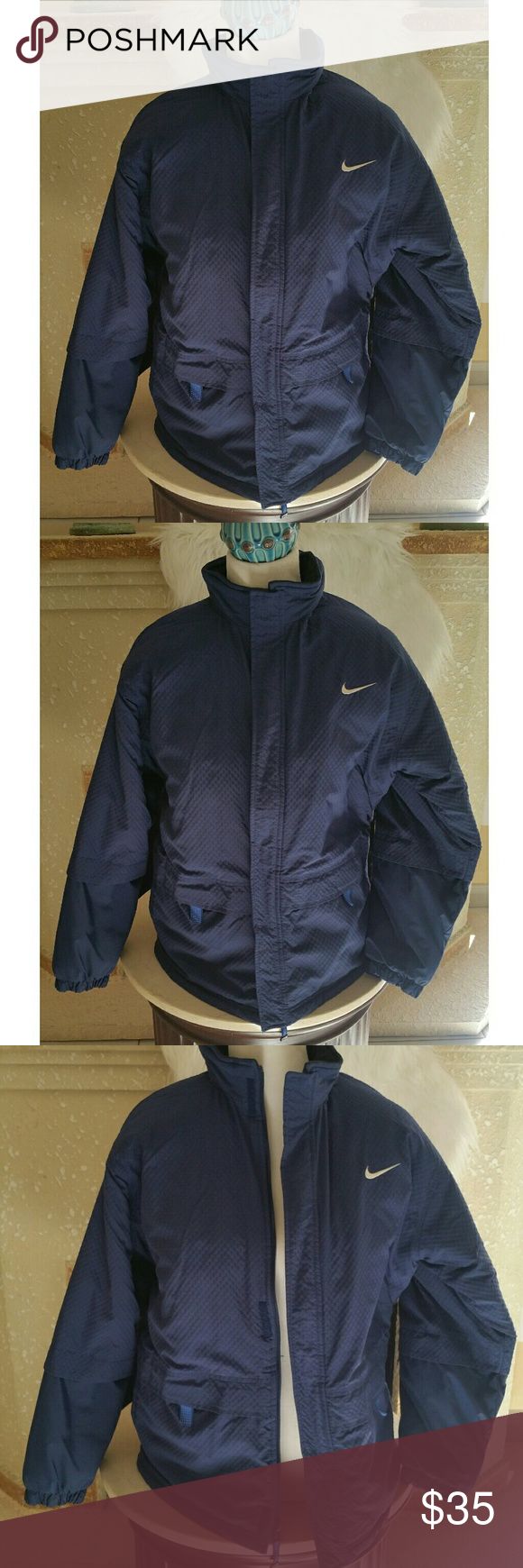 Nike Thermal Winter Navy Blue Puffer Jacket XL Nike Thermal Winter Navy Blue Puffer Jacket Size XL Great Condition  Everything intact Perfect Winter Coat  Shoulder to Hem: 27" Pit to Pit: 22" Hood can be hidden under the Collar Nike Jackets & Coats Puffers Collar Nike, Blue Puffer Jacket, Blue Puffer, Puffer Jacket, Winter Coat, Nike Jacket, Nike Women, Puffer, Athletic Jacket