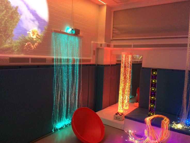 the room is decorated with colorful lights and decorations