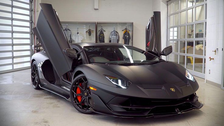 a black sports car parked in a garage