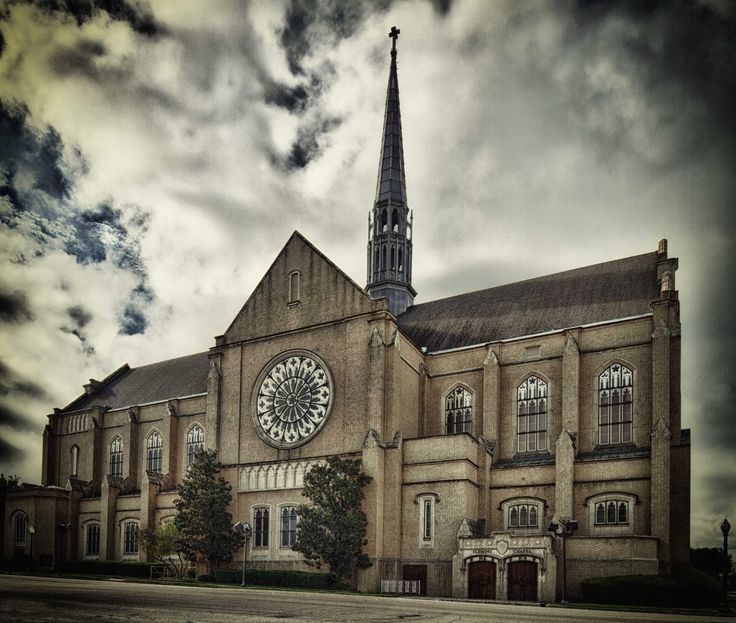 an old church with a large clock on the front