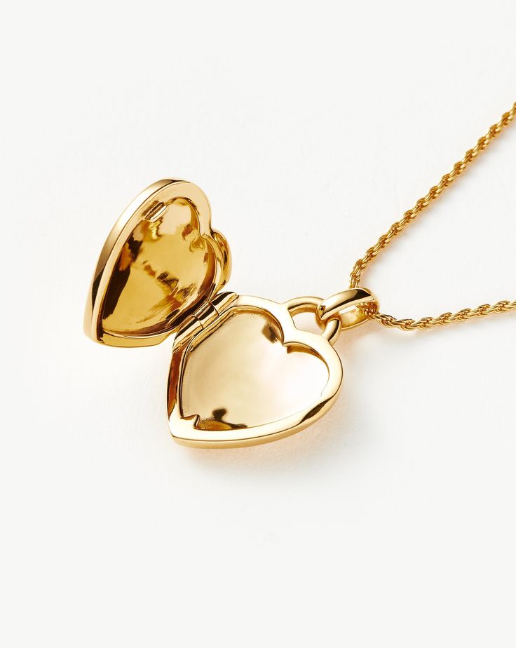 Engravable Heart Ridge Locket Pendant Necklace | 18ct Gold Plated Vermeil/Rainbow Moonstone. Make It Personal with this Engravable Pendant Necklace. Paired with a Delicate Chain, the Heart-Shaped Locket Features a Central Rainbow Moonstone Gem and Signature Ridge Detailing. It Can be Engraved on the Back, as Well as Inside the Locket. Add a Date, Meaningful Message or Personalized Motif to Create a One-Of-A-Kind Jewelry Gift. Please Note: Engraving Items May Take 7-10 Working Days to Process. Me Elegant Heart-shaped Yellow Gold Locket Necklace, Elegant Yellow Gold Heart Necklace Keepsake, Elegant Yellow Gold Heart Necklace For Keepsake, Luxury Heart-shaped Locket Jewelry, Yellow Gold Heart Necklace With Gemstone, Luxury Heart Shaped Locket Jewelry, Yellow Gold Gemstone Heart Necklace, Yellow Gold Plated Heart Locket Necklace, Gold Pendant Heart Necklace With Gemstone