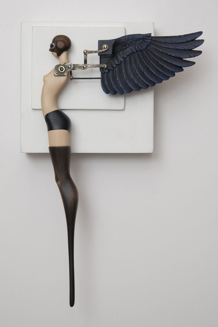 a bird is hooked up to a light switch with wings on it's back