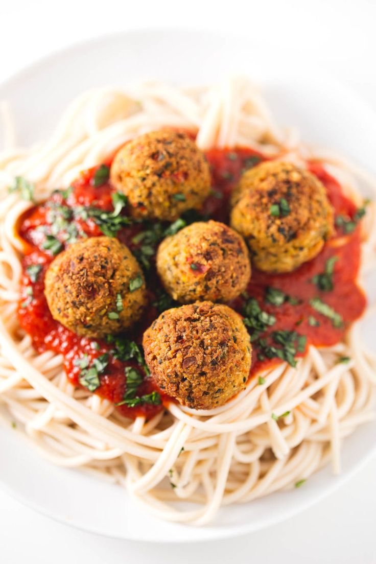 spaghetti with meatballs and sauce on top