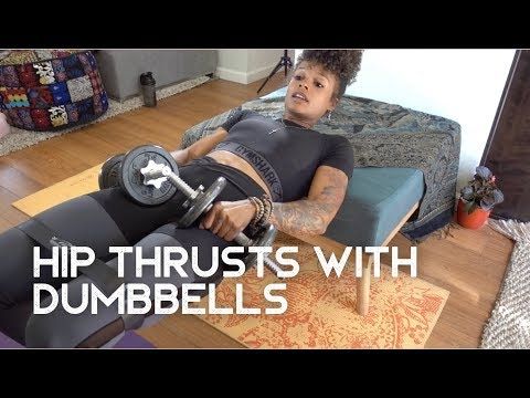 a man sitting on top of a couch with dumbbells in his hand and the words hip thrusts with dumbbells