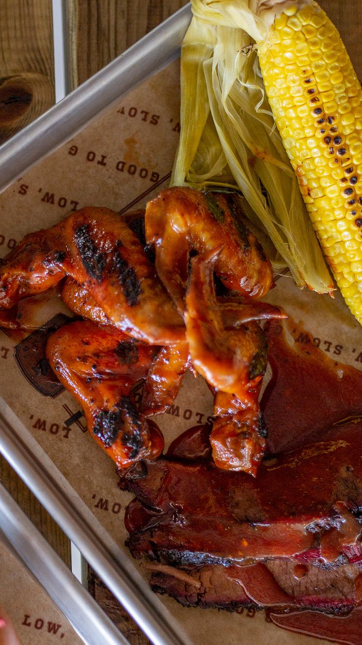 ribs and corn on the cob with barbecue sauce