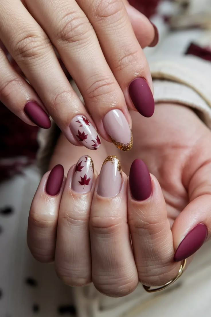 Embrace the beauty of the season with these chic Autumn short nails. Featuring a cozy mix of deep burgundy and shimmering gold accents, this stunning style captures the essence of fall perfectly. The rich colors evoke the changing leaves, making it a perfect choice for any autumn occasion. Transform your look with these delightful fall nail ideas and let your nails shine with seasonal elegance! #FallNailIdeas #AutumnNails #ChicNails #NailArt Short Nails Design Ideas 2024 Autumn, Maroon Autumn Nails, Thanksgiving Nails Burgundy, Autumn Burgundy Nails, Elegant Fall Nail Art, Fall Leaves Nails Design, Fall Nail Designs Leaves, Nail Design Ideas Fall, Autumn Design Nails