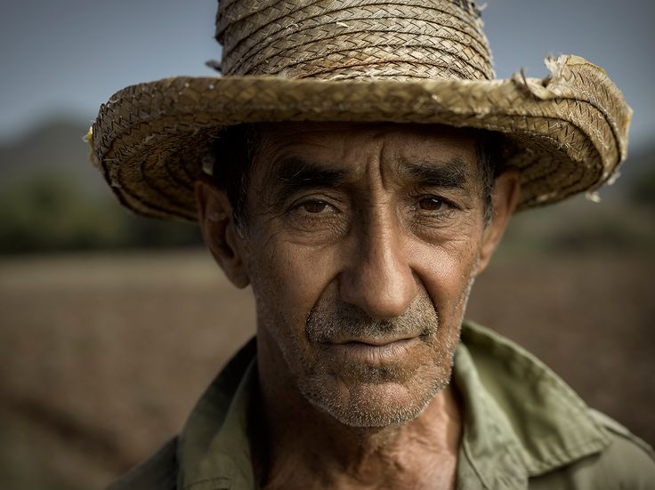 a man with a straw hat on his head