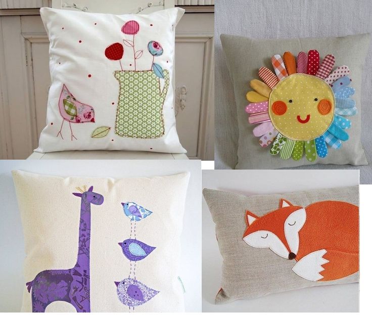 four pillows with different designs on them and one has a giraffe, an owl, and a bird