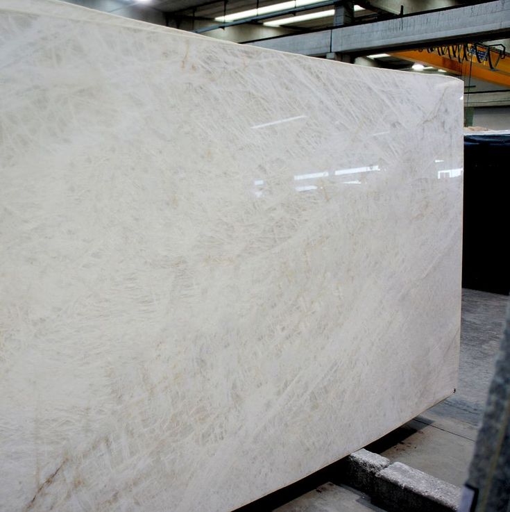 a large white marble slab in a warehouse