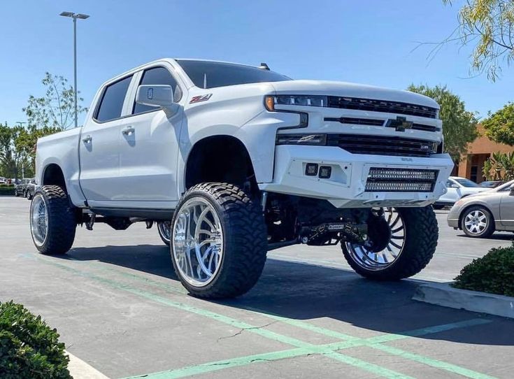 a white truck parked in a parking lot