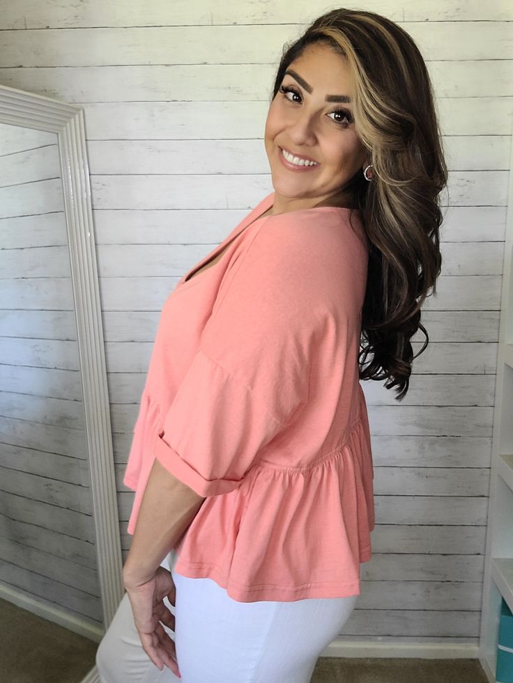 Get ready for some fun in the sun with our Coral Babydoll Top. The loose fitting design and functional buttons provide comfort and convenience while the ruffled bottom layer adds a playful touch. Made of soft, stretchy fabric for all-day comfort. Breezy Ruffled Tops For Day Out, Ruffled Tops For Beach, Ruffled Tops For Vacation, Stretch Ruffle Tops For Vacation, Stretch Ruffled Tops For Vacation, Pink Ruffle Hem Top For Summer, Cute Ruffle Sleeve Tops For Day Out, Stretch Ruffle Top For Beach, Breezy Cotton Tops With Ruffles