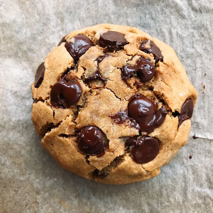 a chocolate chip cookie on top of a piece of paper