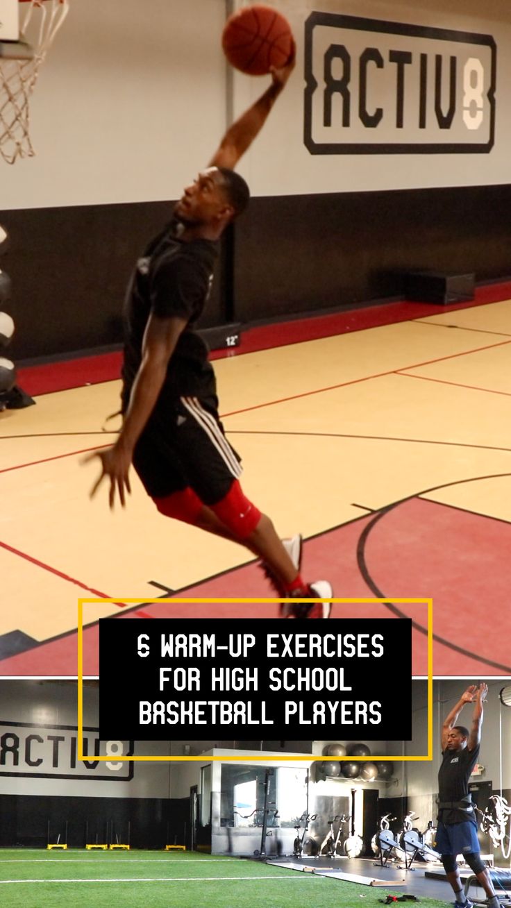 a man jumping up in the air to dunk a basketball on a gym floor