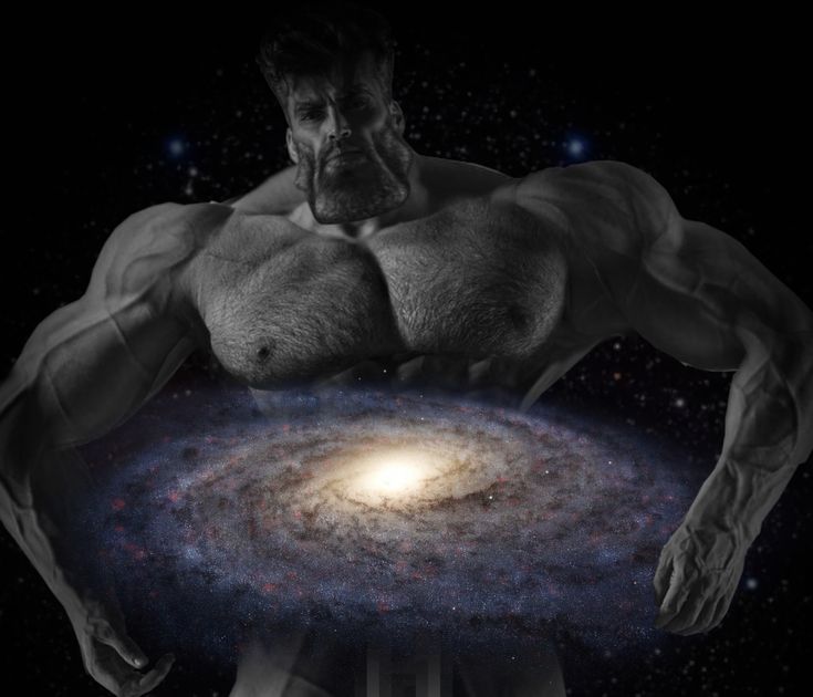 a man standing in front of a spiral galaxy