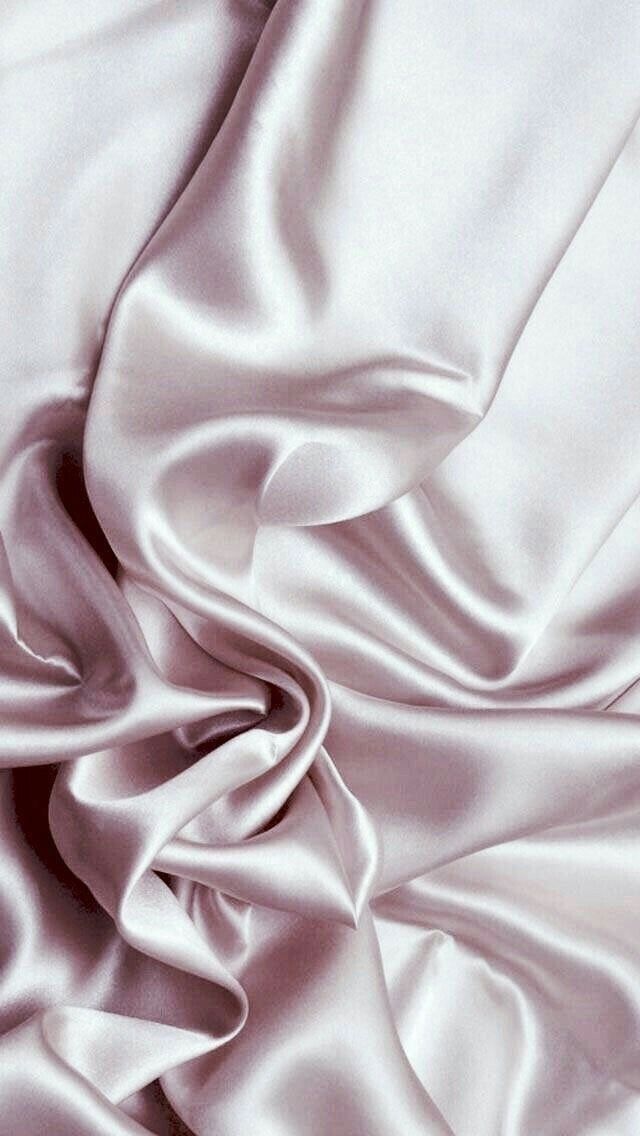 the white fabric is very soft and smooth, but it doesn't look like silk