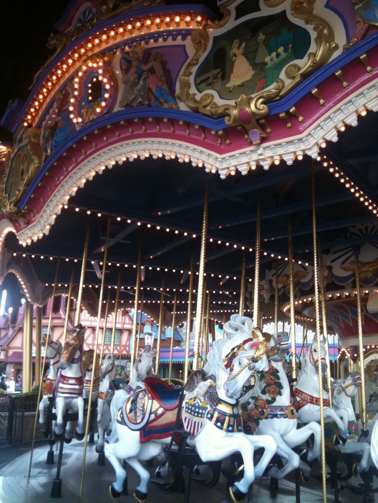 the merry go round has many horses on it