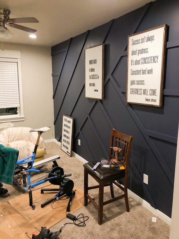 a living room filled with furniture and a wall mounted on the side of it's wall