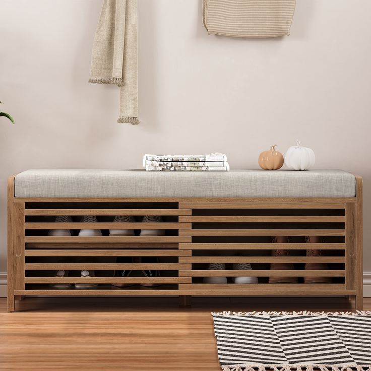 a wooden bench sitting on top of a hard wood floor