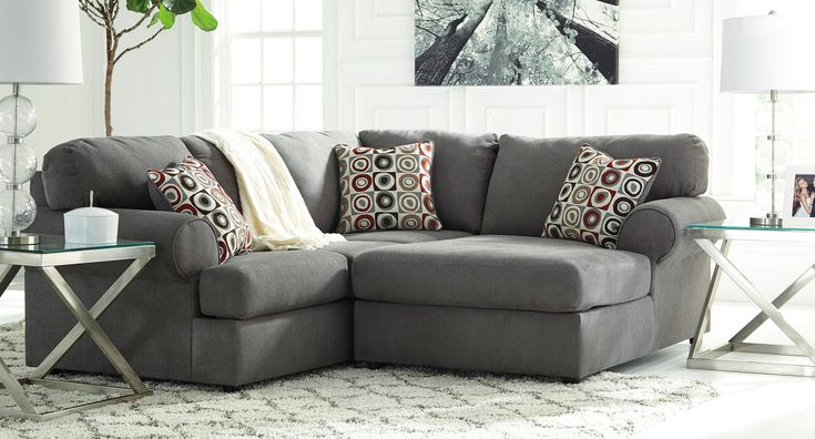 a living room scene with focus on the corner sofa