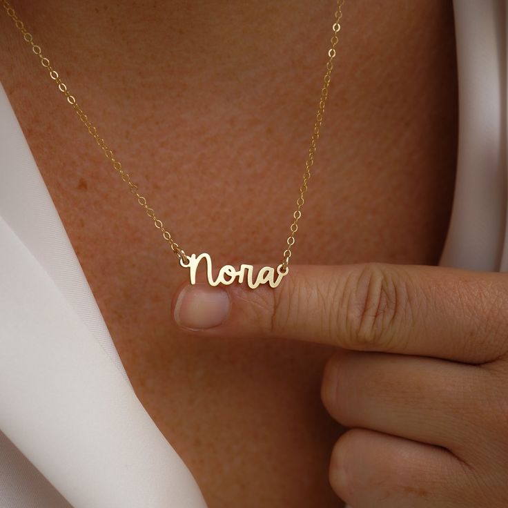 Escape to the Amalfi coast with our beautiful Amalfi Name Necklace! Its delicate design will turn heads and inspire confidence - making you feel like you can conquer anything! NECKLACE FEATURES Choice of 18k gold plating over sterling silver or Sterling Silver handcrafted custom name pendant (approx.* 1", up to 10 characters) Choice of Metal: Gold Fill or Sterling Silver Choice of Chain Style: Cable Chain or Upgraded Specialty Link Chain All necklace findings are gold filled/sterling silver. Eac Name Pendant, The Amalfi Coast, Personalized Pendant, Freshwater Pearls Earrings, Chain Extenders, Delicate Design, Bohemian Necklace, Handcrafted Necklace, Yellow Gold Chain