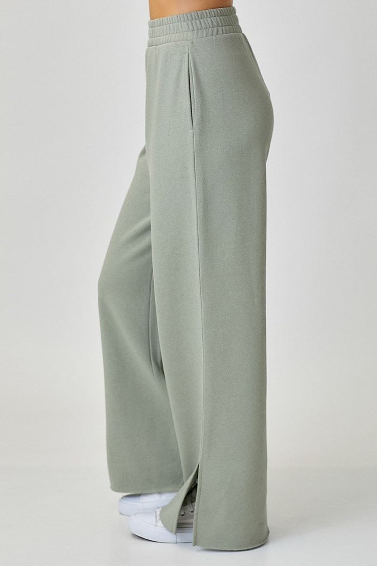 Change up your loungewear game with the Wendy Wide Leg Lounge pants. Crafted from a luxuriously soft 55% cotton/45% Polyester blend, these chic-yet-effortless pants feature a high 11.75" rise and 29.75" inseam that let you move with ease and comfort. With a look that's both relaxed and refined, you'll be in lounge-ready mode in no time. Ready to upgrade your loungewear? Model Info: Height 5'8" | Waist 24" | Hips 34 Solid Wide-leg Yoga Pants For Lounging, Comfortable Solid Color Lounge Pants, Chic Solid Color Sweatpants, Solid Wide Leg Pants For Spring Lounging, Solid Color Wide Leg Pants For Spring Lounging, Versatile Full-length Sweatpants For Lounging, Versatile Full-length Lounging Sweatpants, Spring Wide Leg Yoga Pants For Relaxation, Wide Leg Yoga Pants For Spring Relaxation