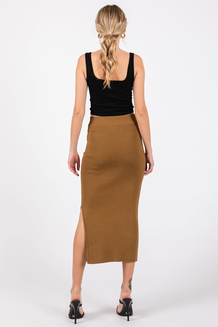 Details A ribbed midi skirt with an elastic waistband, and a side slit. Content + Care 68% Viscose 32% PolyesterHand Wash Cold, No Bleach, Do Not Tumble Dry, Hang DryImport Size + Fit Length: 33"Measured From: SmallProduct Code: 94616Model Stats: Height: 5'7"Bust: 34"Hips: 34"Wearing Size: Small Knit Midi Skirt, Knit Midi, Mocha, Trendy Outfits, Rib Knit, Midi Skirt, Bleach, Elastic, Skirt