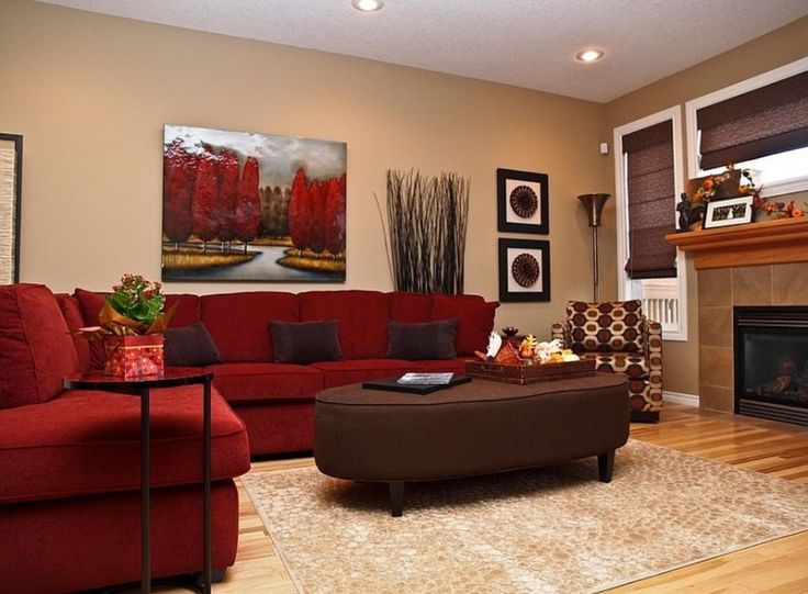 a living room filled with furniture and a fire place in the middle of a room