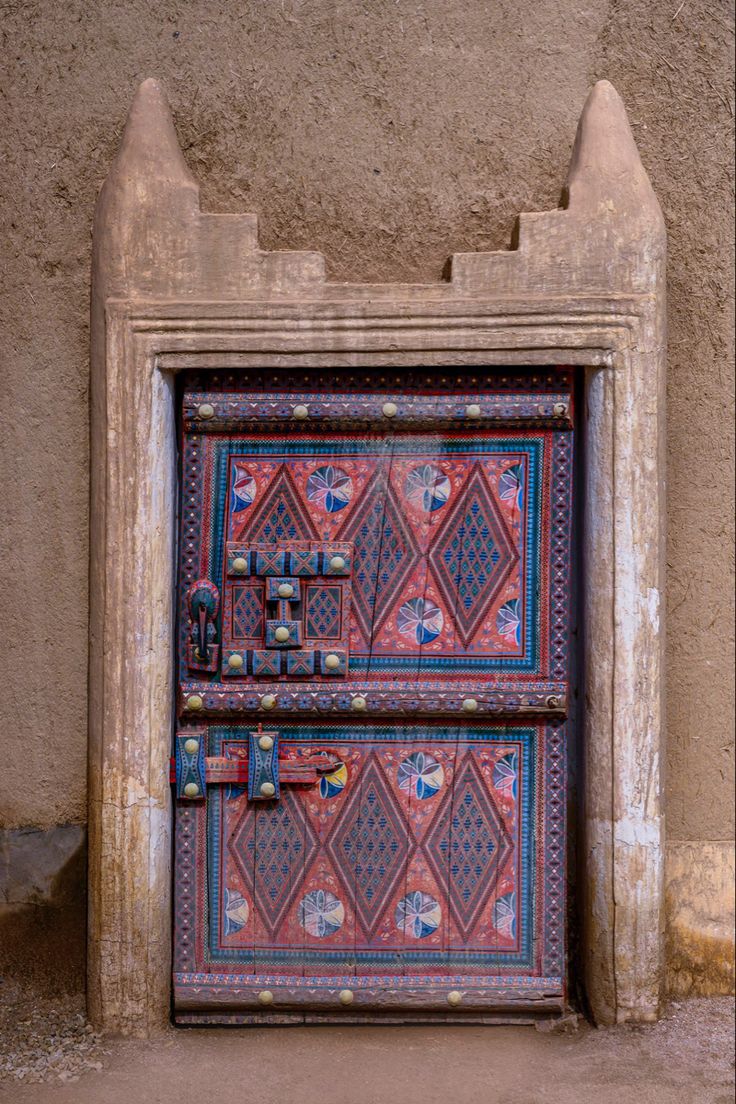 an old door with decorative designs on it