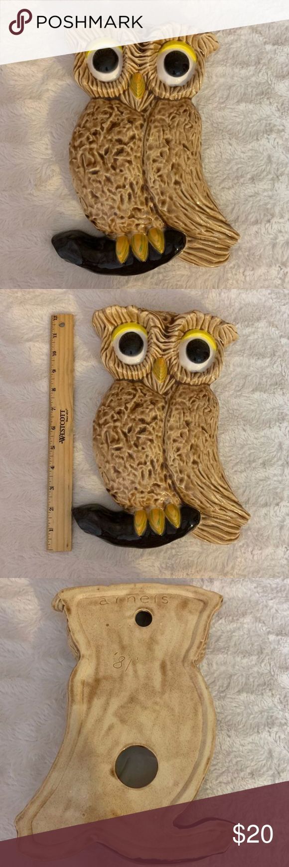 three wooden owls sitting on top of each other