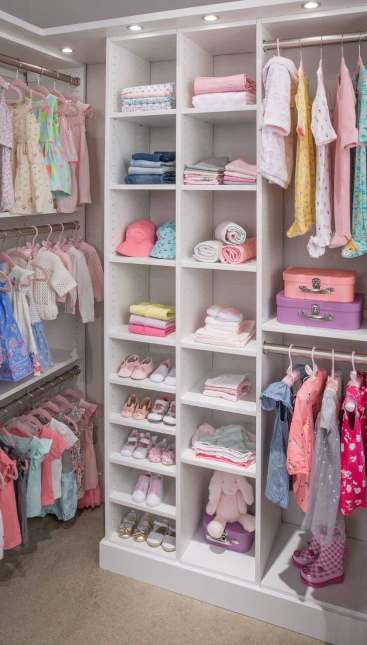 a closet filled with lots of different types of clothes and shoes on shelves next to each other