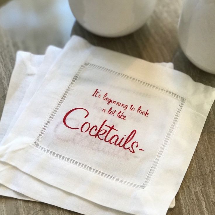 two napkins that say it's beginning to look like cocktails