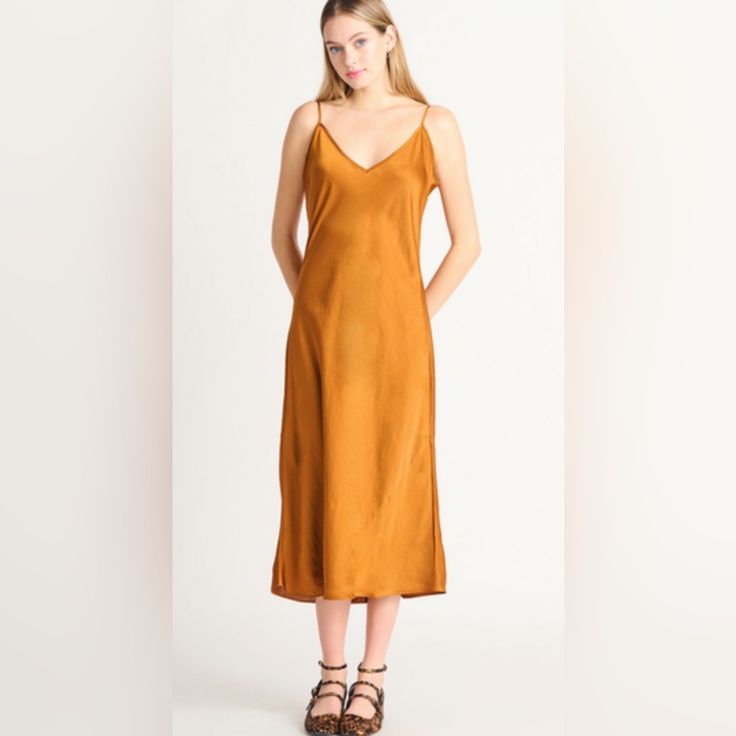 Step Into Pure Luxury And Elegance With The Black Tape Satin Slip Dress - A Stunning, Silky Smooth Golden Brown Dress With Adjustable Straps That Will Make You Feel Like A True Fashion Goddess. Gold V-neck Slip Dress For Spring, Golden Brown Dress, Black Tape, Midi Slip Dress, Satin Slip, Satin Slip Dress, Brown Dress, Golden Brown, Brown Gold