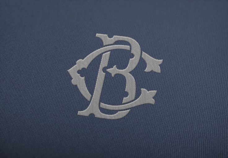 the monogrammed letter b is shown in silver on a blue background