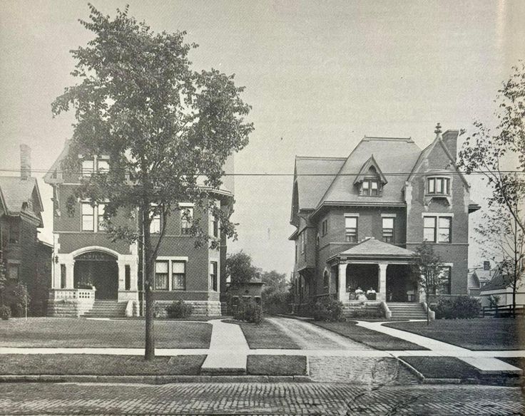 an old black and white photo of some houses