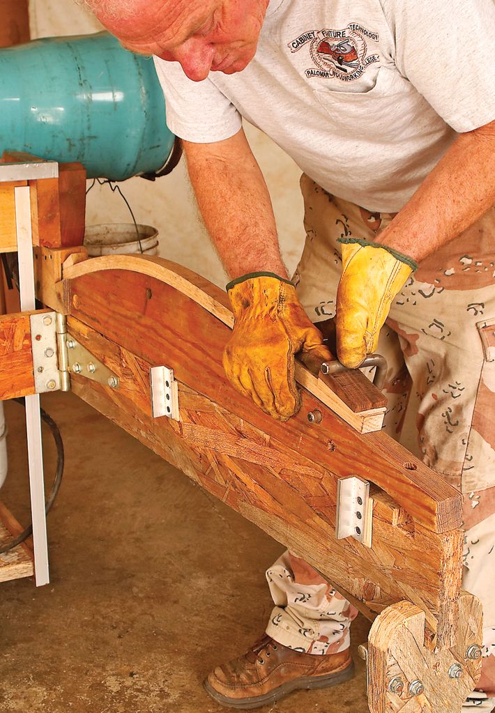 a man working on a piece of wood