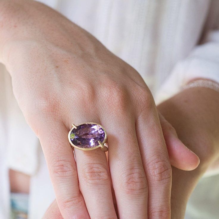 "14K solid gold double banded amethyst gemstone cocktail ring for woman.  A classical handmade double banded 14K solid gold ring, in a contemporary design set with a large beautiful natural clear purple amethyst gemstone.  Every jewelry collection needs a fine statement cocktail ring that will stand up and help you shine in any special occasion.  This ring, made from the finest materials is lightweight and comfortable to wear, perfect for parties, a day out on the town with your girlfriends and is a brilliant keepsake gift for your loved one.  Product Details: * One solid gold statement ring. * Set with gemstone. * Double banded. Materials: * 14K solid yellow gold. * Clear purple amethyst gemstone Measurements (approx): *Ring size in stock: 7 (us) ready to be shipped in 3-5 days. * Hight 1 Luxury Elegant Amethyst Ring For Formal Occasions, Luxury Faceted Amethyst Ring In Fine Jewelry Style, Luxury Purple Amethyst Ring For Gift, Luxury Handmade Gold Amethyst Ring, Elegant Amethyst Promise Ring, Elegant Amethyst Ring With Gemstone Accents For Promise, Elegant Lavender Amethyst Ring In 14k Gold, Formal Amethyst Birthstone Ring With Gemstone Accents, Oval Amethyst Ring In 14k Gold