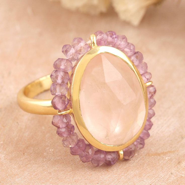 Indian designer Neetu Barathi brings us a superb creation featuring a six-carat rose quartz stone, symbolizing unconditional love. This precious gem is also embellished with little amethyst beads along the bezel for a dapper look. On top of that, the cocktail ring is crafted from 18k gold-plated sterling silver, making a high-quality accessory. Multi-stone Pink Sapphire Jewelry For Gifts, Pink Sapphire Multi-stone Jewelry For Gifts, Luxury Pink Amethyst Ring As Gift, Luxury Pink Amethyst Ring For Gift, Rose Gold Multi-stone Jewelry With Pink Sapphire, Elegant Multi-stone Amethyst Ring Gift, Rose Gold Multi-stone Pink Sapphire Jewelry, Luxury Amethyst Ring With Gemstone Accents As Gift, Luxury Pink Amethyst Gemstone Ring